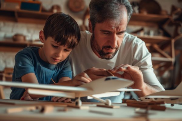 Father and Son Building Airplane Model