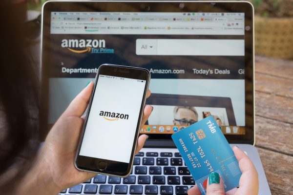CHIANG MAI,THAILAND - OCT 01, 2017 : iPhone 6s showing Amazon logo and credit card shopping online. Amazon.com, Inc. American international electronic commerce company.