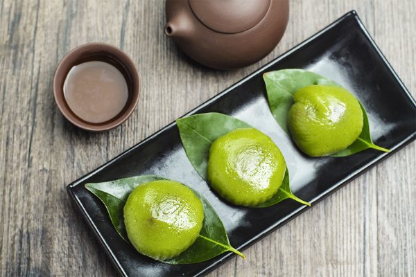 sweet green rice ball and purple clay teapot