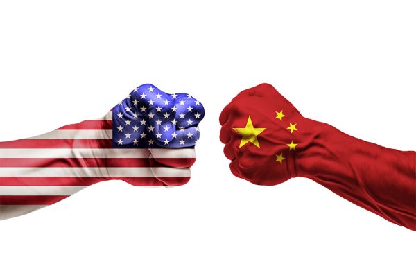 Conflict USA vs. China, fists facing each other with a transpare