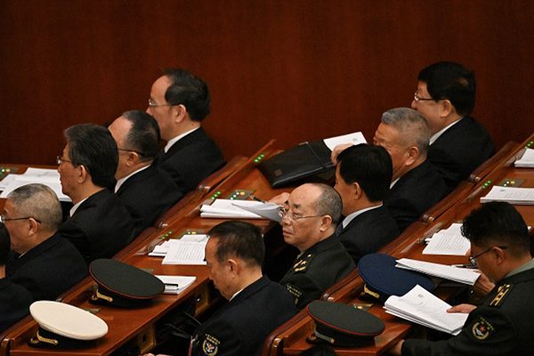 圖為2024年3月8日，在北京舉行的第14屆全國人民代表大會第二次全體會議上。(Pedro Pardo/AFP via Getty Images)